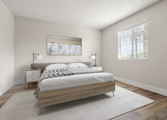 a bedroom with a bed and two nightstands
